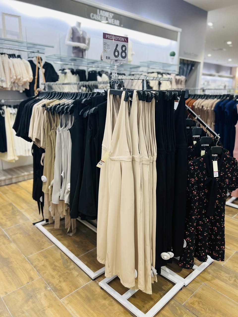 Shoppers browsing fashion items in a department store