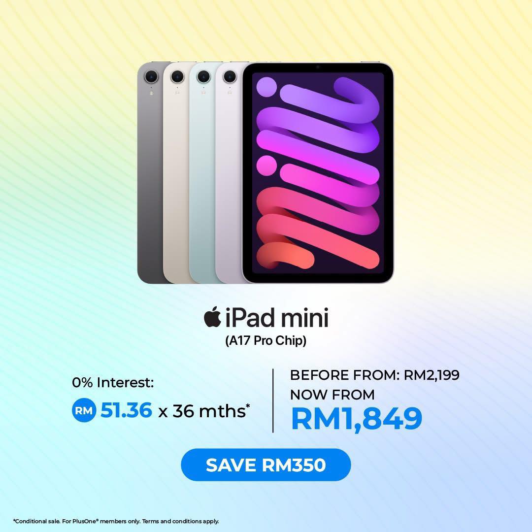 Happy customer browsing Apple products during a sale