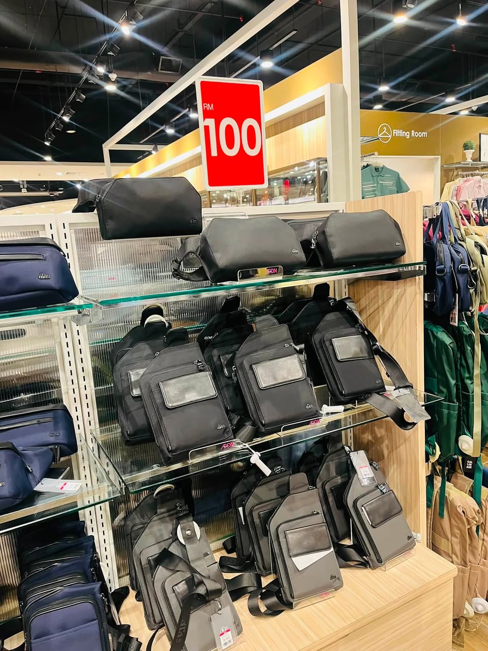 Crossbody and messenger bags on glass shelves