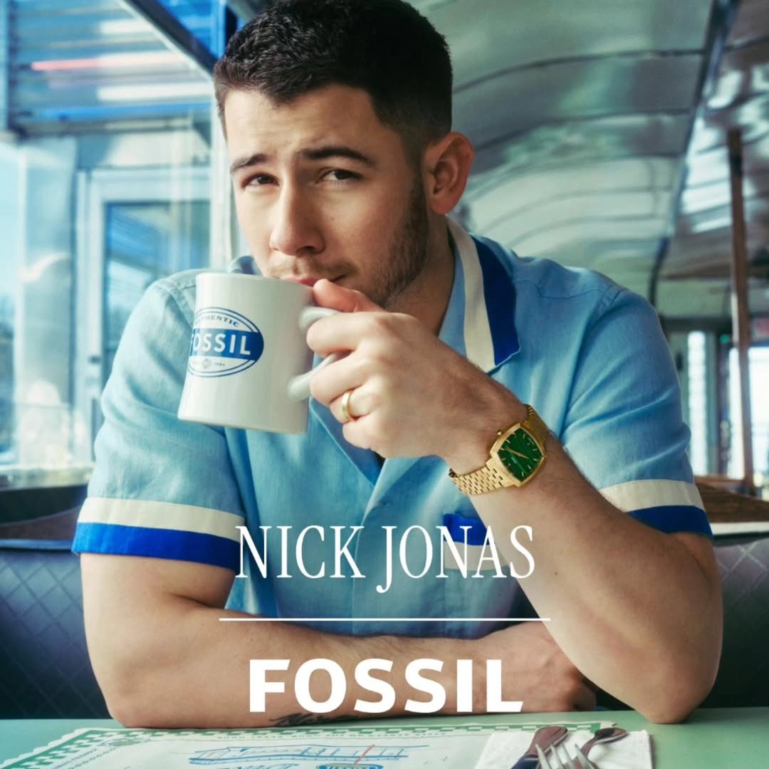 Nick Jonas showcasing a Fossil limited edition watch