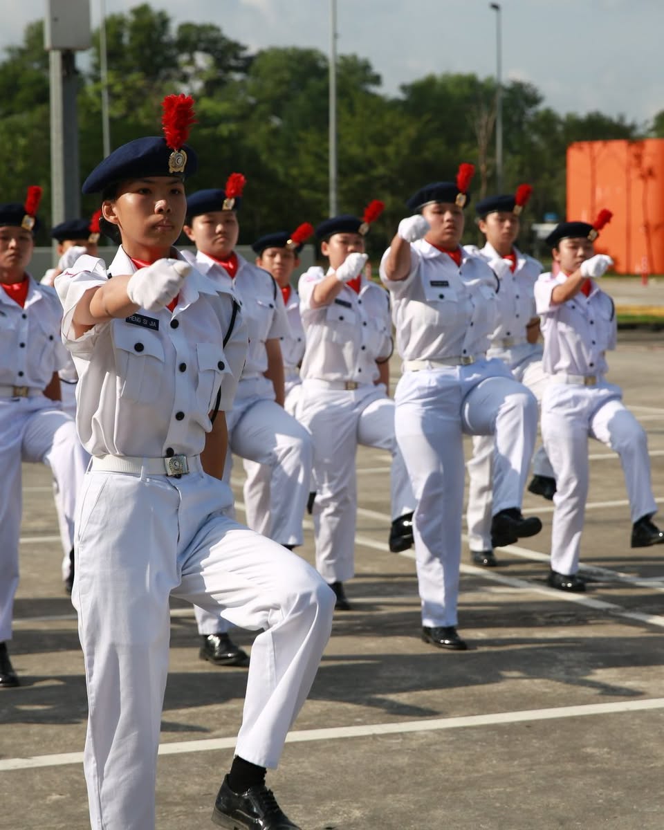 Marching contingent performing drill movements