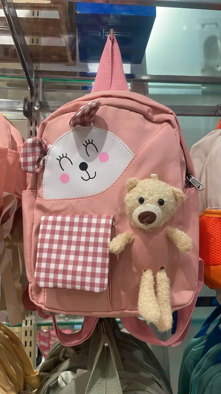 Pink cartoon face backpack