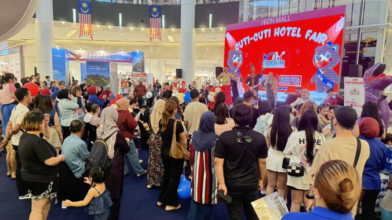 Visitors exploring various booths and offerings at the tourism fair