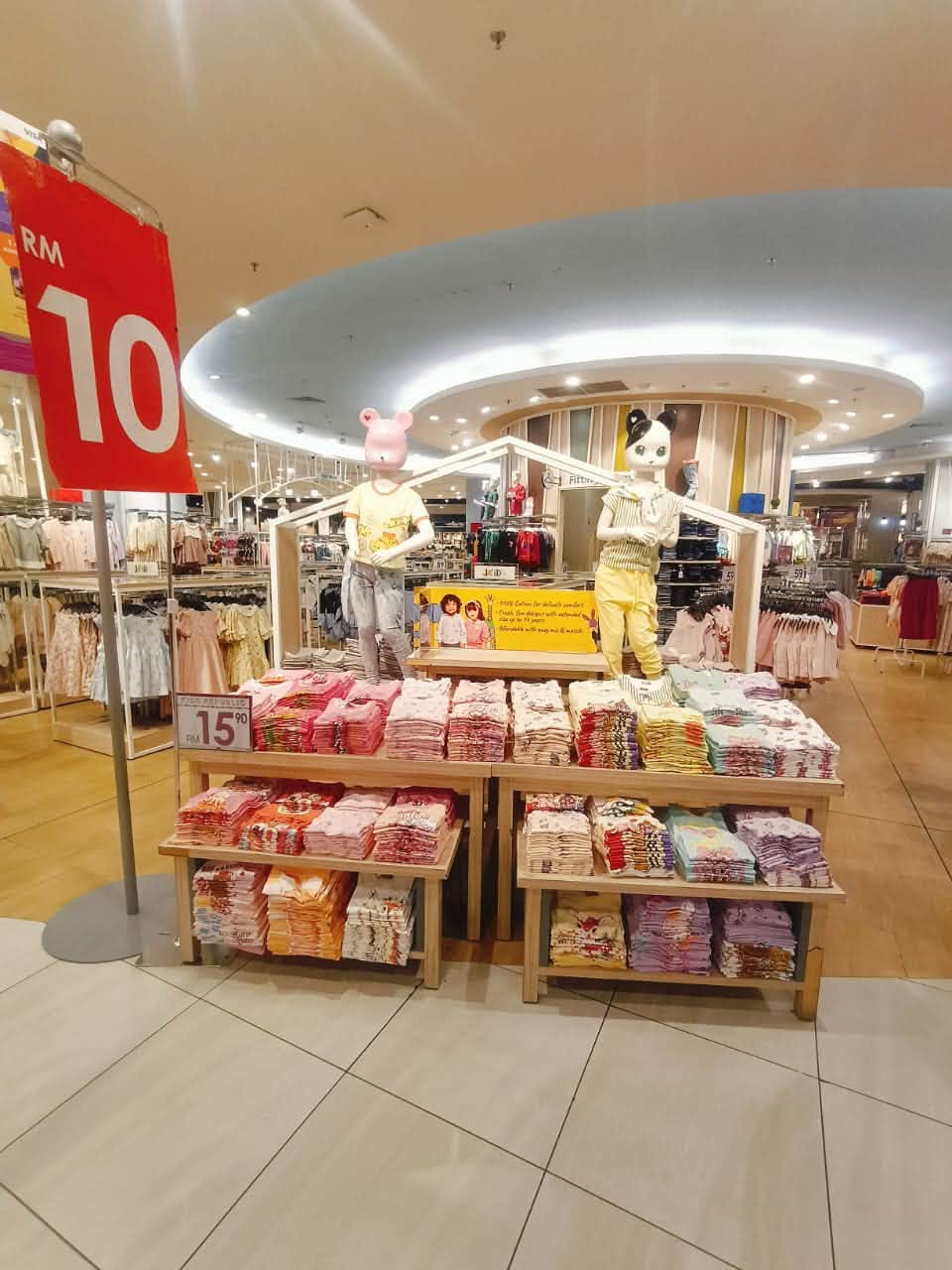Baby clothing display with RM10 and 15% off promotions