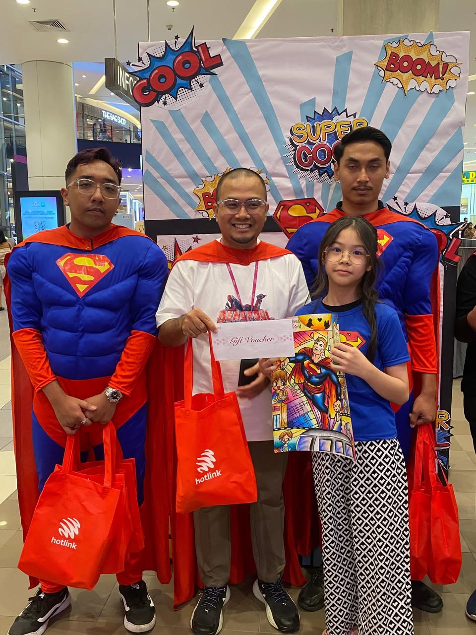 Children enthusiastically participating in the Superman Colouring Contest.