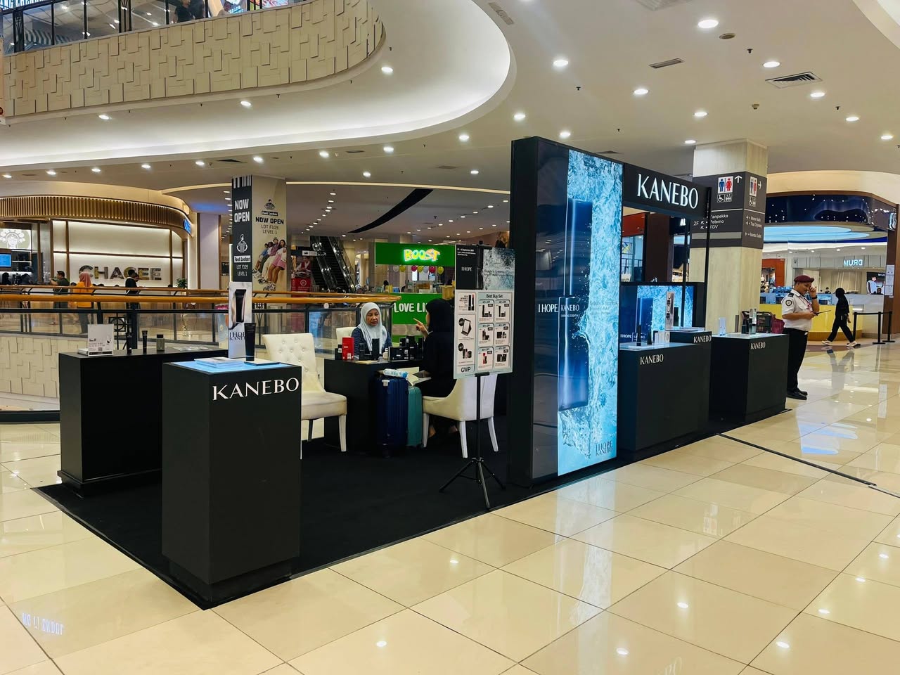Kanebo booth with blue-themed product displays