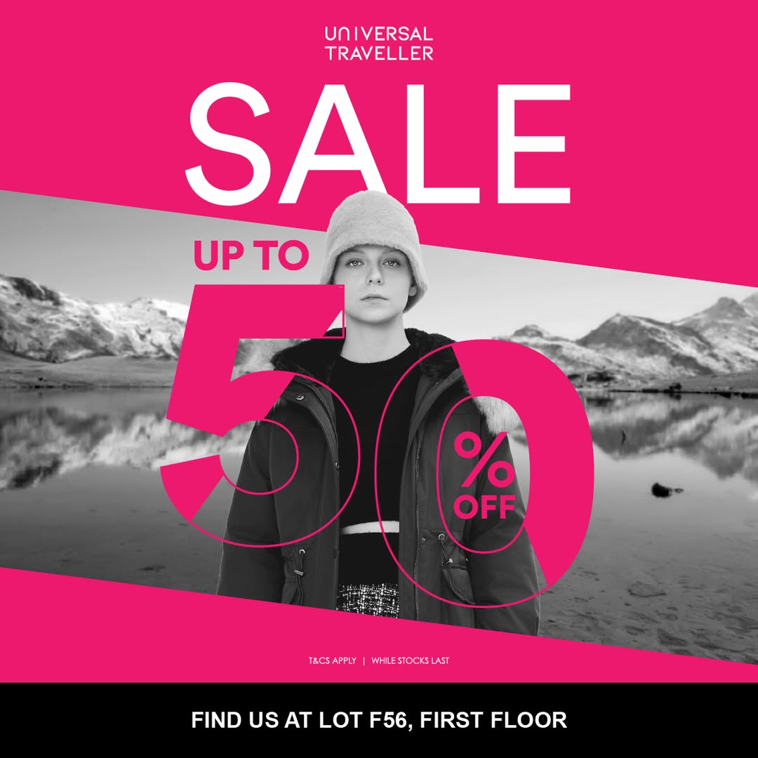 A vibrant display of winter wear, luggage, and travel accessories on sale.