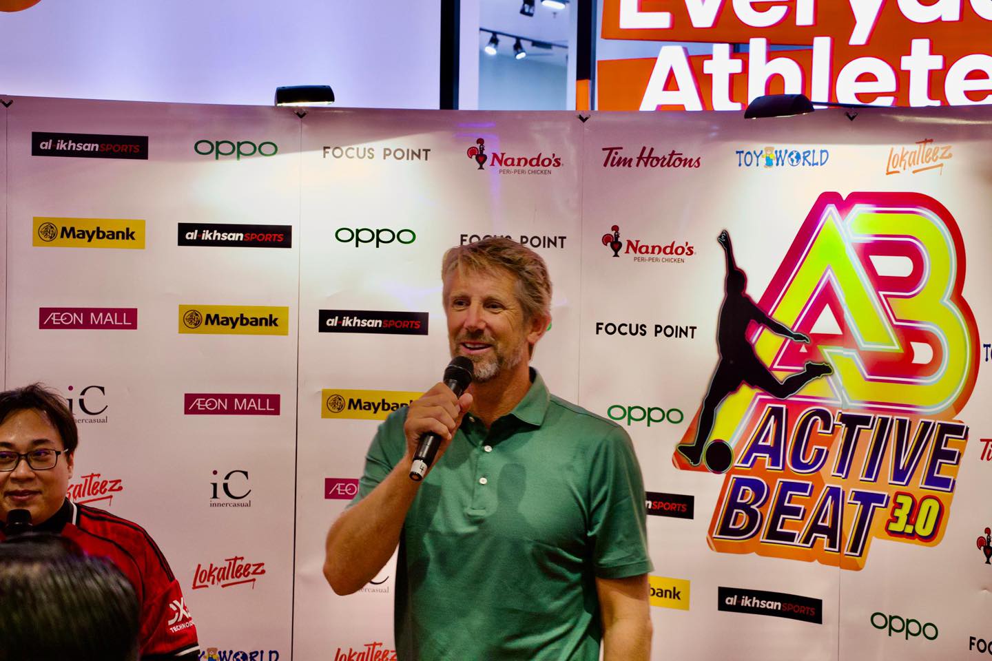 Edwin van der Sar smiling and acknowledging the cheering crowd.