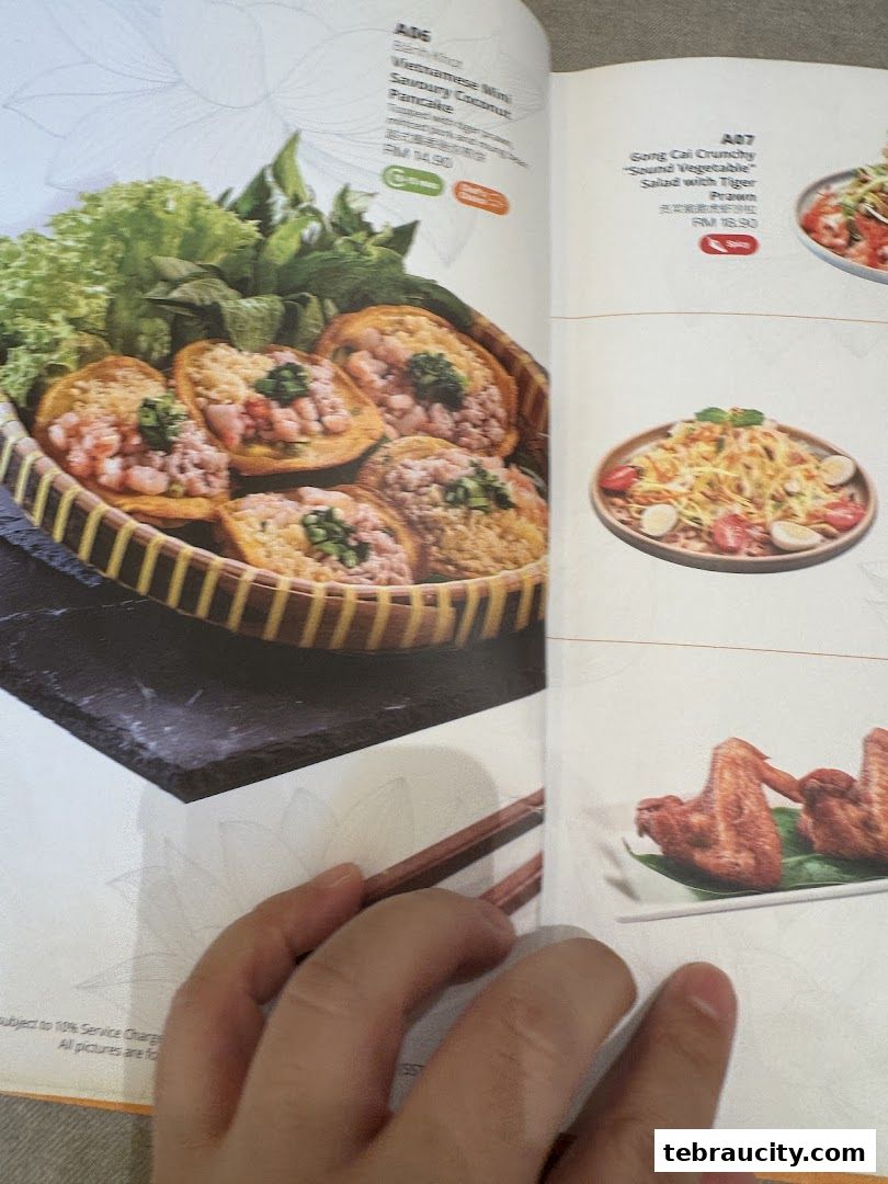 A menu page showcasing Vietnamese dishes, including mini savory pancakes and a crunchy vegetable salad.