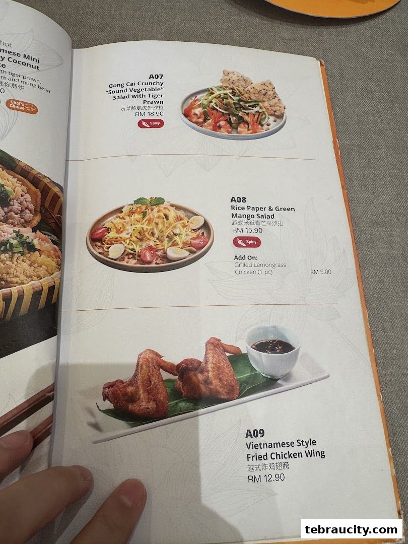A menu page showcasing Vietnamese dishes like salads and fried chicken wings.