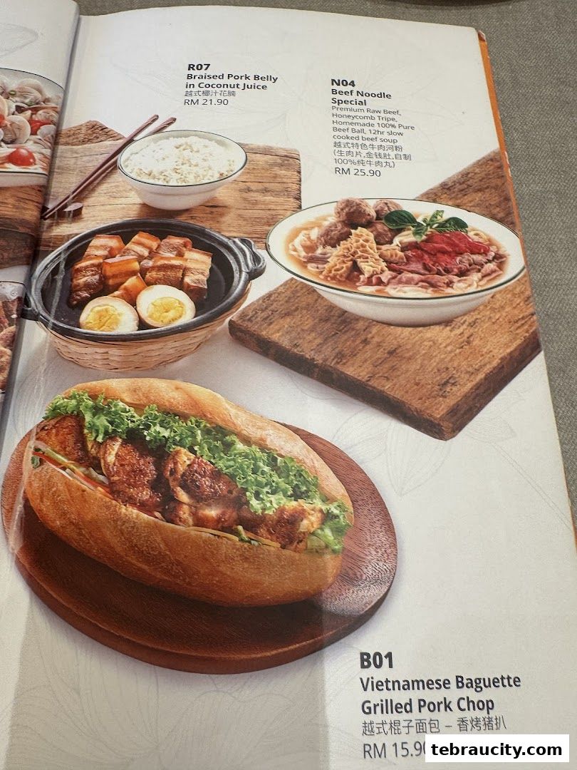 A menu page showcasing Vietnamese dishes including pork belly, beef noodles, and a baguette sandwich.
