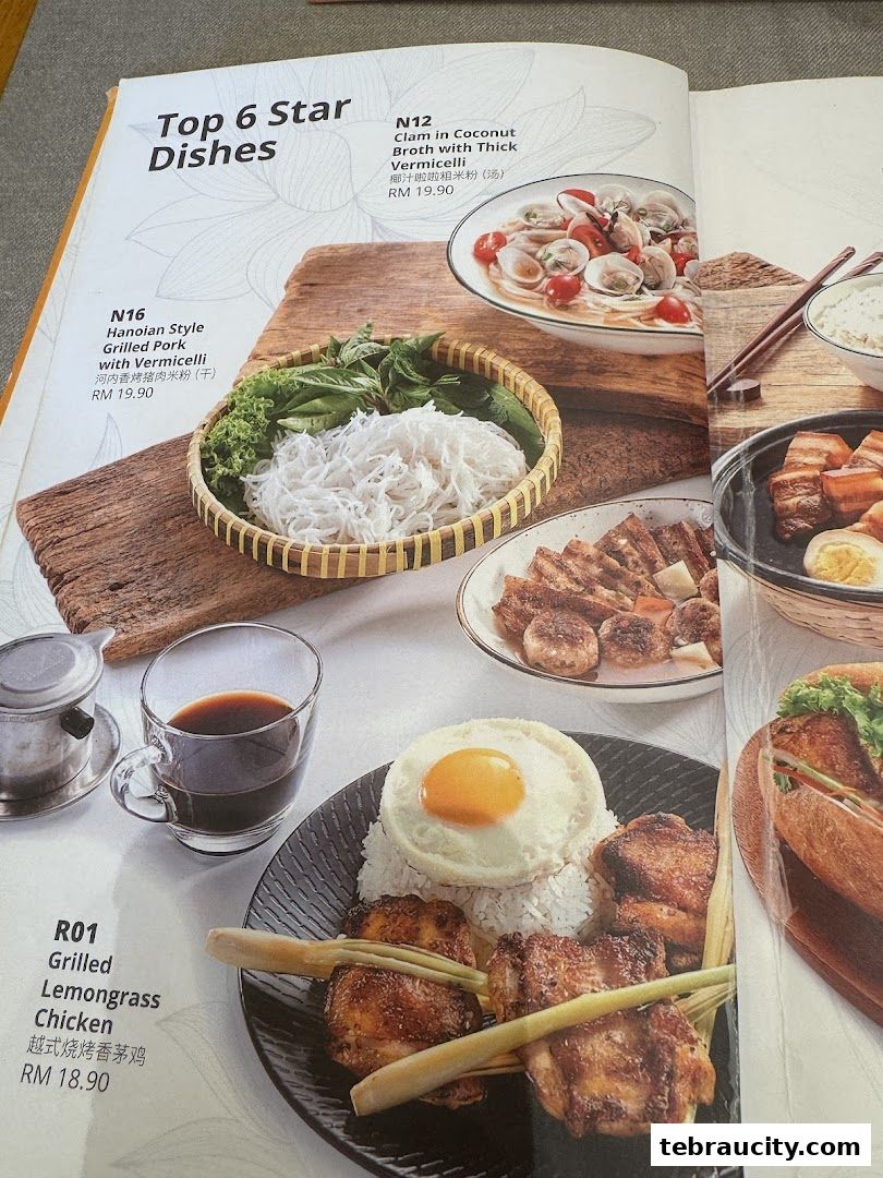 A menu showcasing Vietnamese dishes including grilled lemongrass chicken and clam soup.