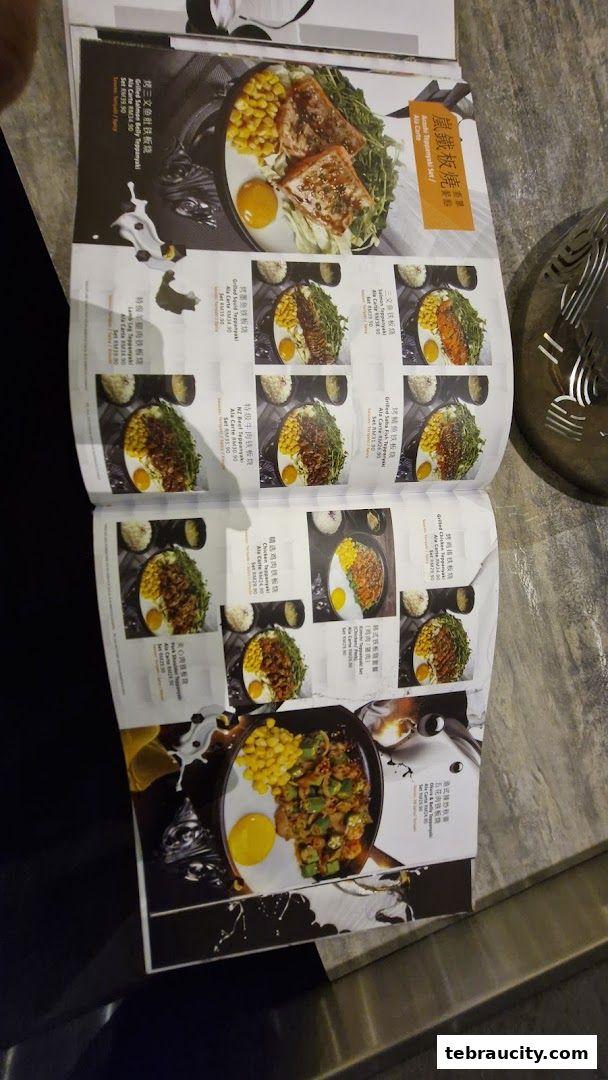 A menu showcasing various teppanyaki dishes with images and prices.