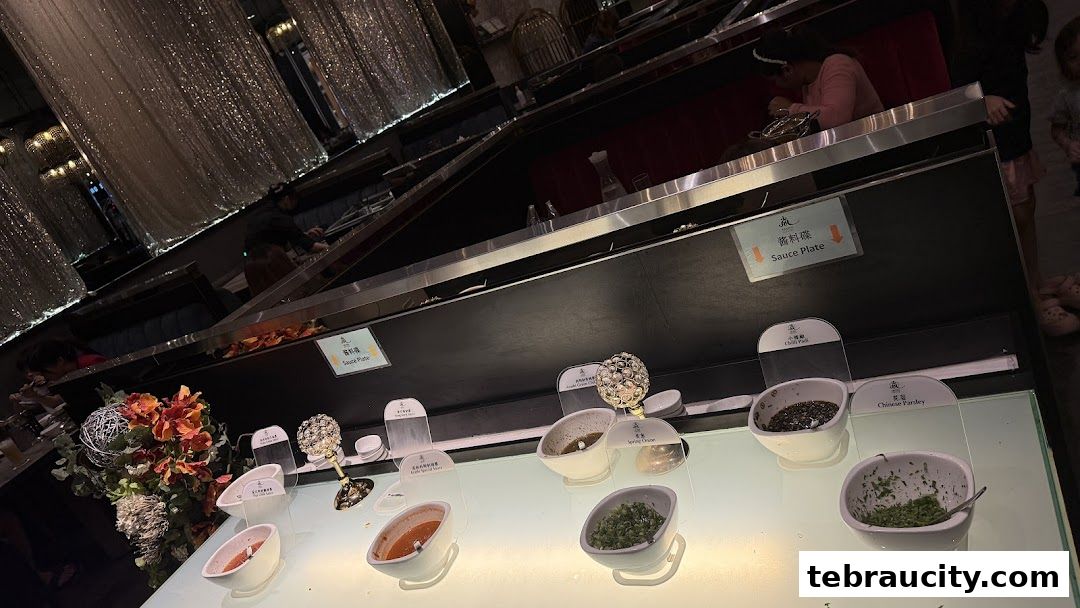 A selection of sauces and toppings displayed at a shabu-shabu restaurant.
