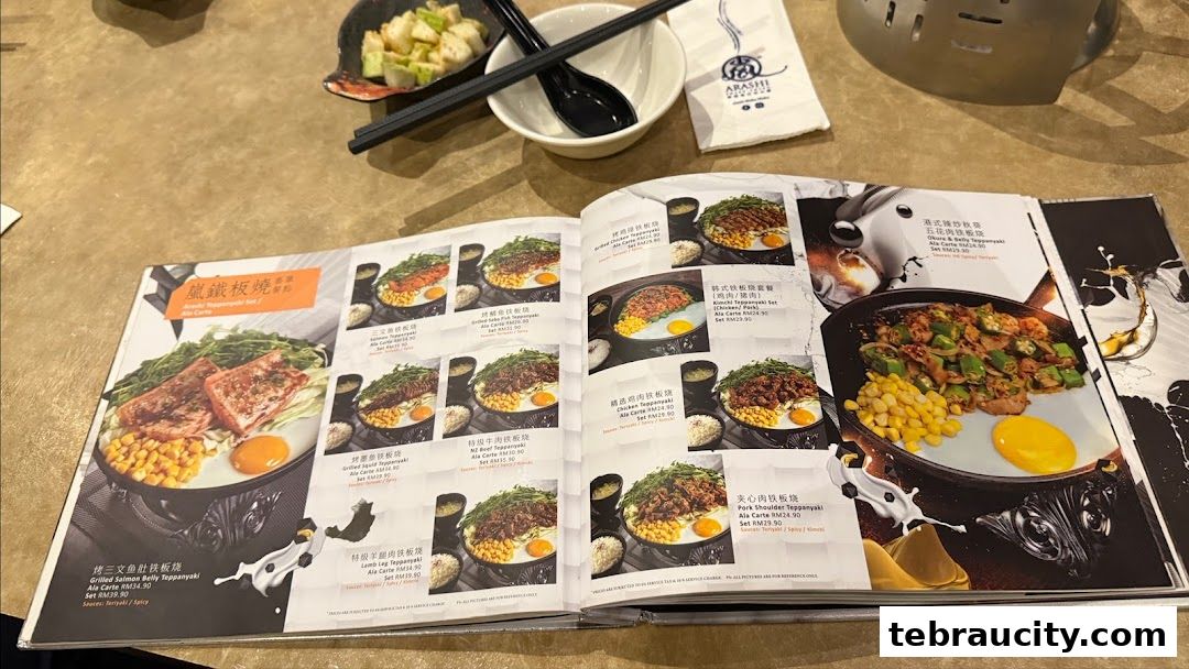 A menu from Arashi Shabu-Shabu featuring various teppanyaki dishes with appetizing photos.