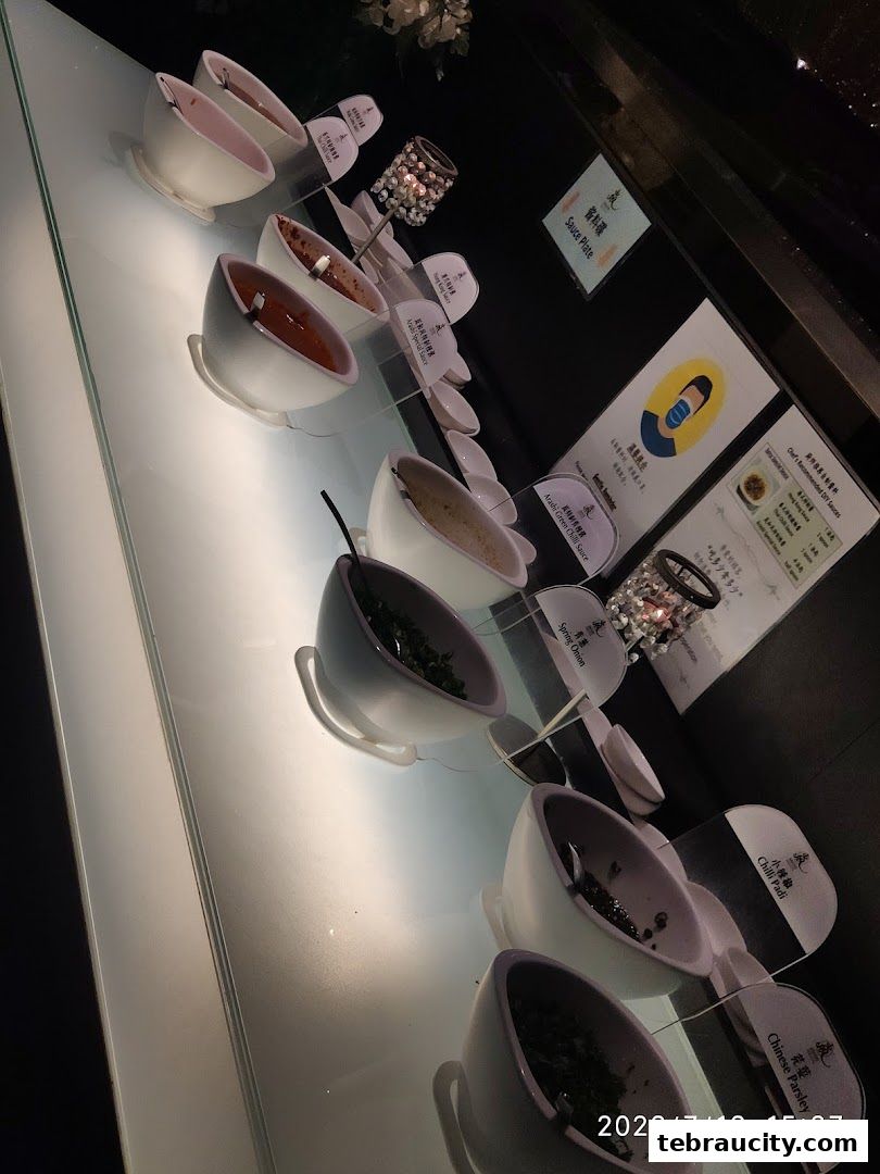 A selection of sauces and condiments displayed in bowls at Arashi Shabu-Shabu.