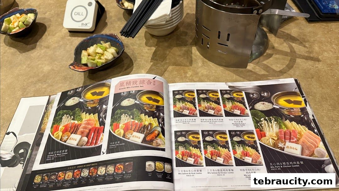 A menu open to a page showcasing various shabu-shabu combo sets with images and prices.