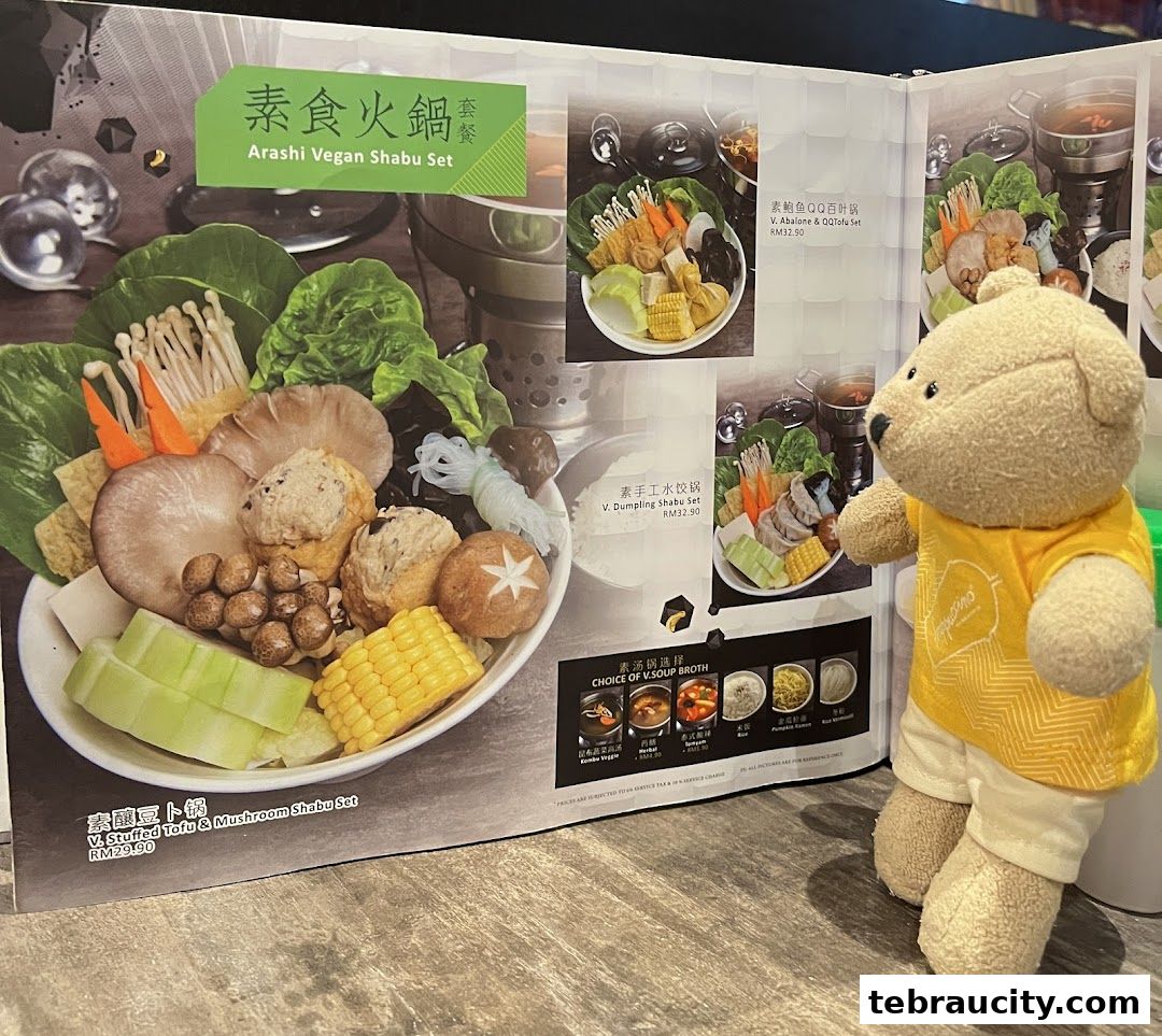 A menu featuring various shabu-shabu sets with a teddy bear in the foreground.