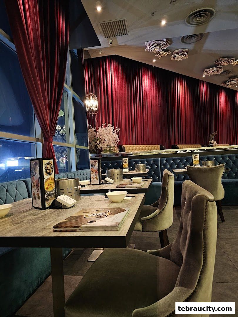 Interior view of a shabu-shabu restaurant with plush seating and elegant decor.