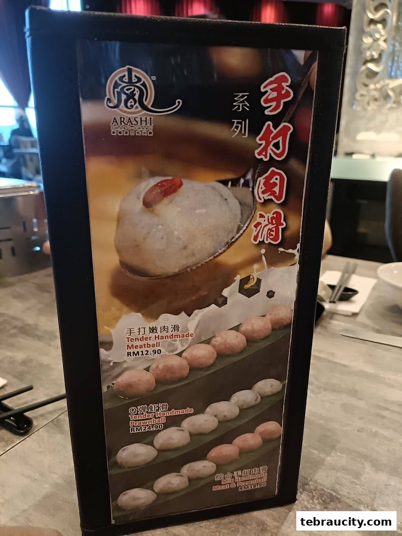 A menu display featuring various handmade meatballs and prawnballs from Arashi Shabu-Shabu.