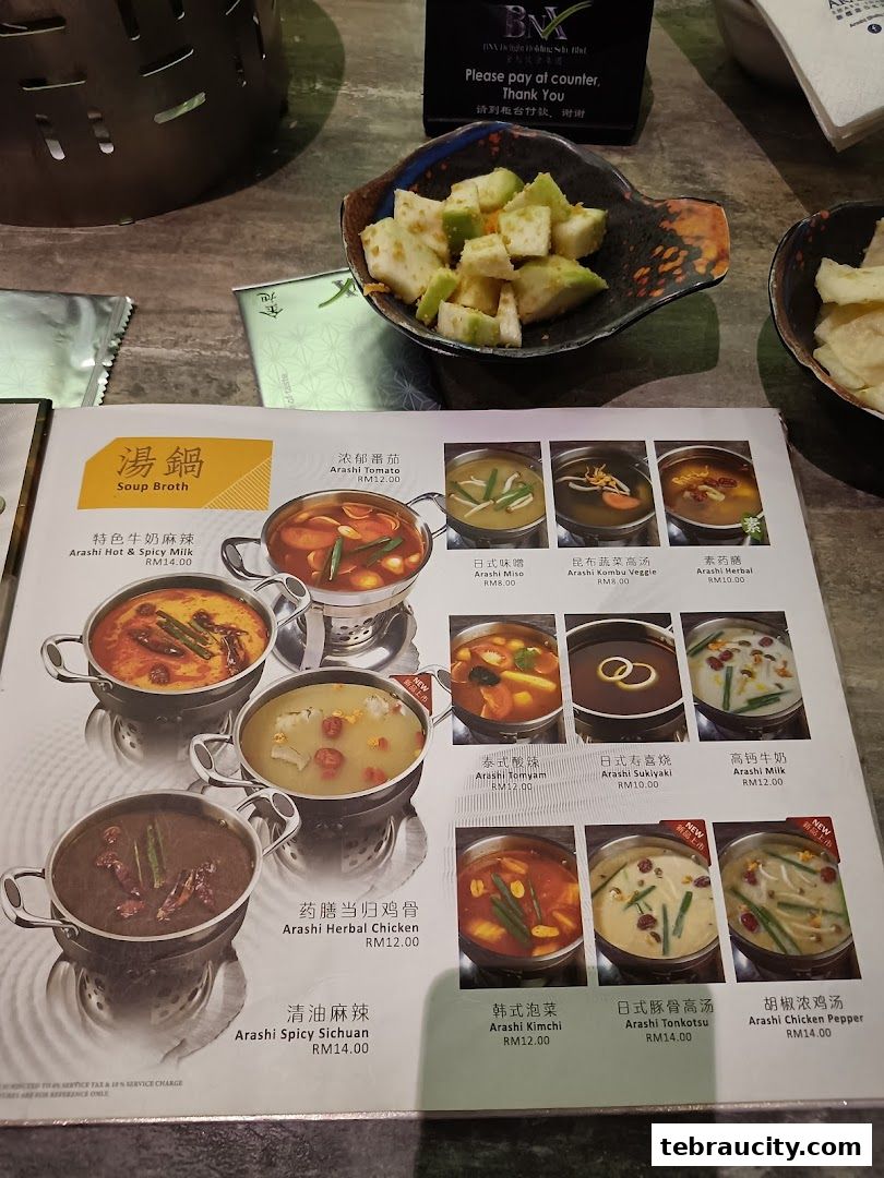 A menu showcasing various Arashi Shabu-Shabu soup broths with prices.