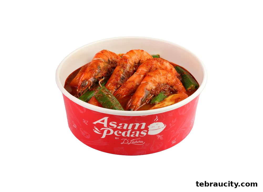A bowl of Asam Pedas with prawns and okra, branded by D Laksa.