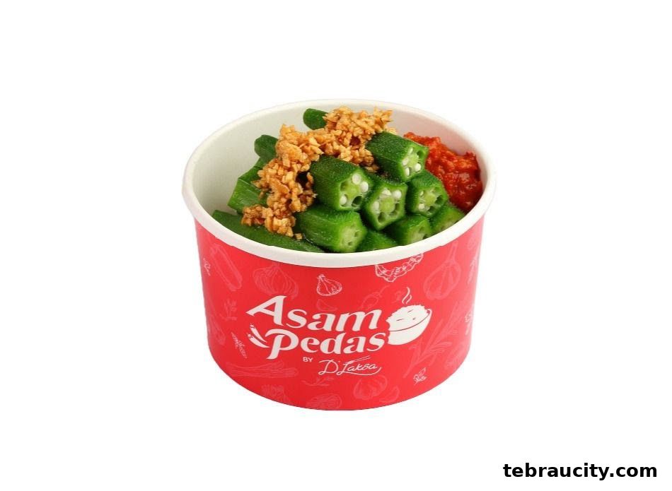A bowl of okra with fried garlic and chili paste, branded Asam Pedas by D Laksa.
