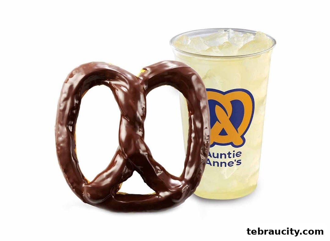 A chocolate-covered pretzel and a lemonade drink with the Auntie Anne's logo.