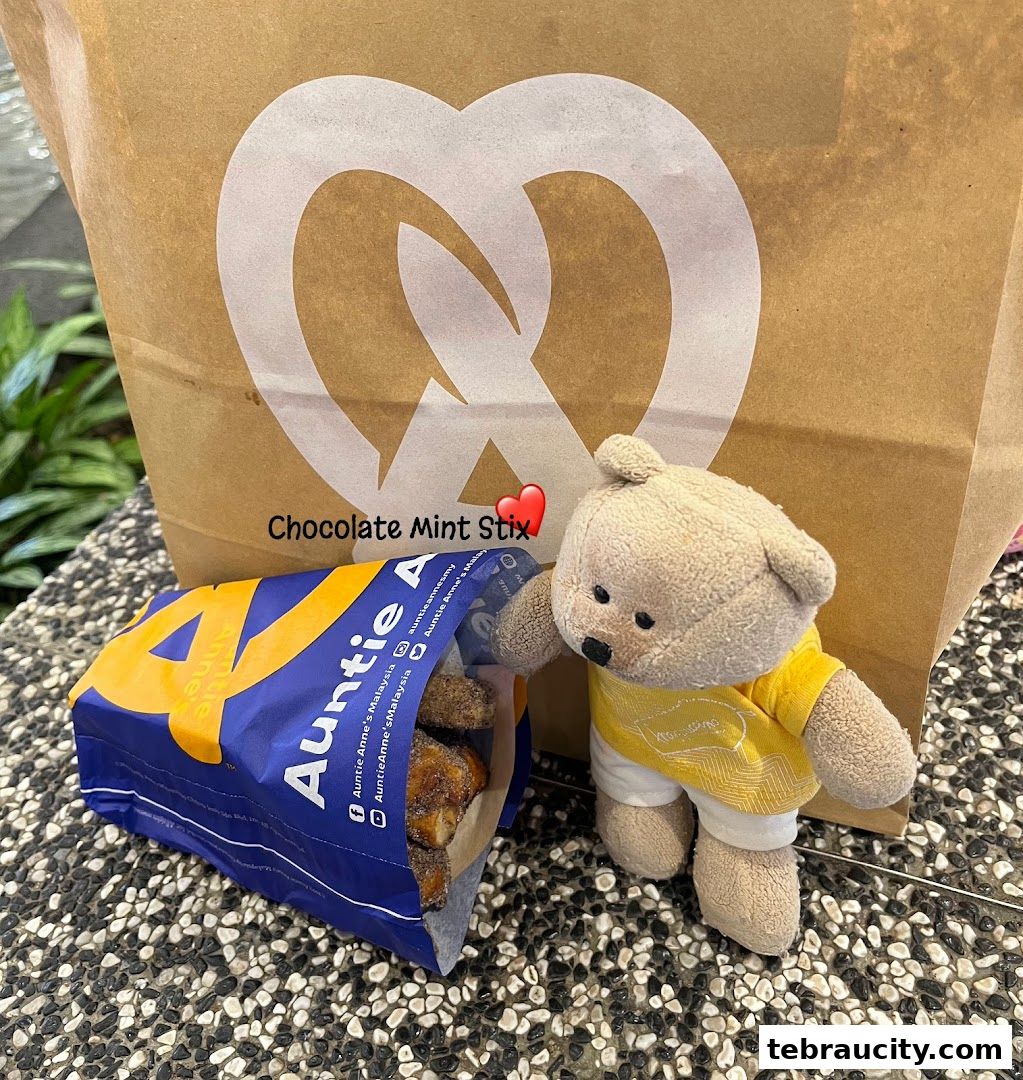 Auntie Anne's pretzel bag with a teddy bear and a box of pretzel bites.