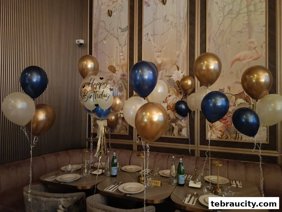 A table setting decorated with balloons for a birthday celebration.