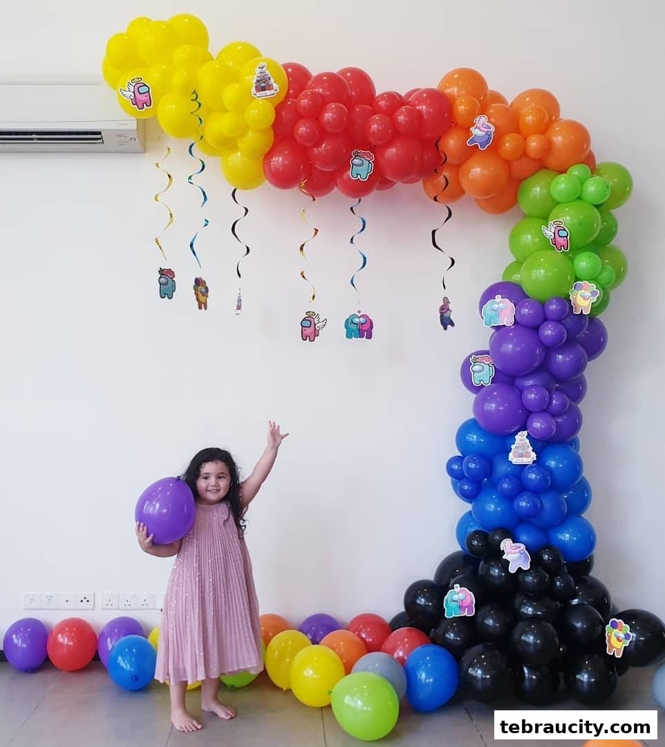 A young girl poses with a purple balloon in front of a colorful balloon arch decorated with 'Among Us' characters.