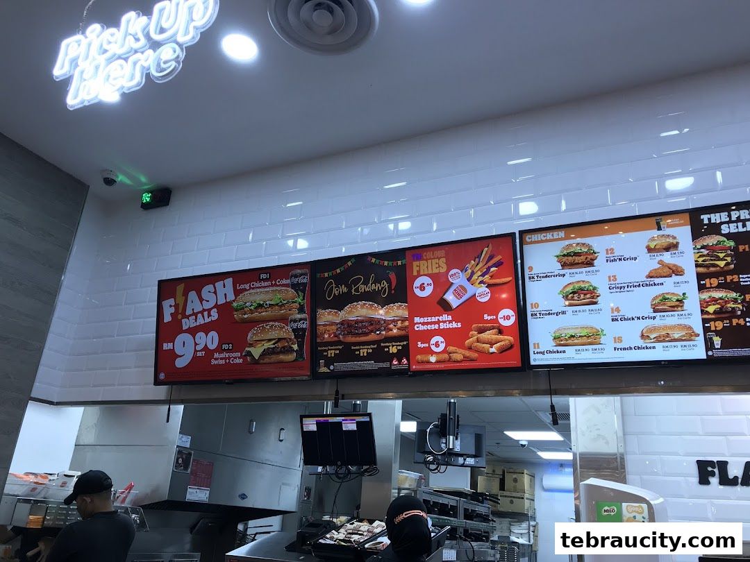 Digital menu boards displaying various Burger King meals and promotions.