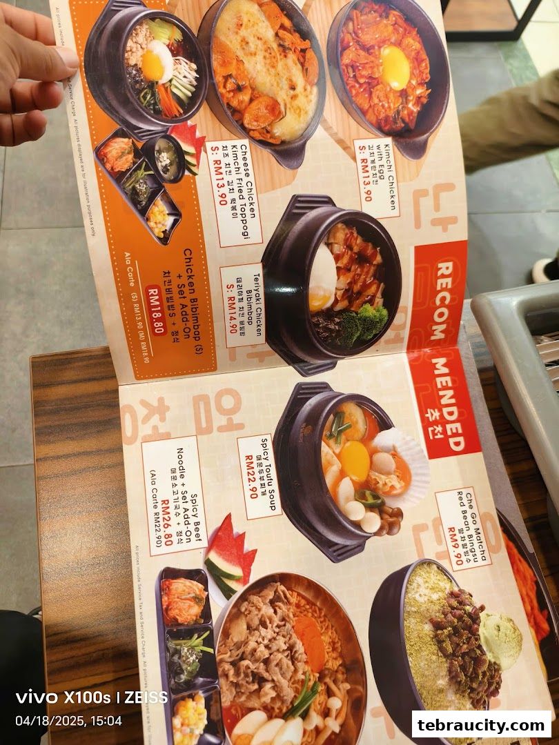 A menu from Chego Korean BBQ featuring various Korean dishes like bibimbap, fried chicken, and soup.