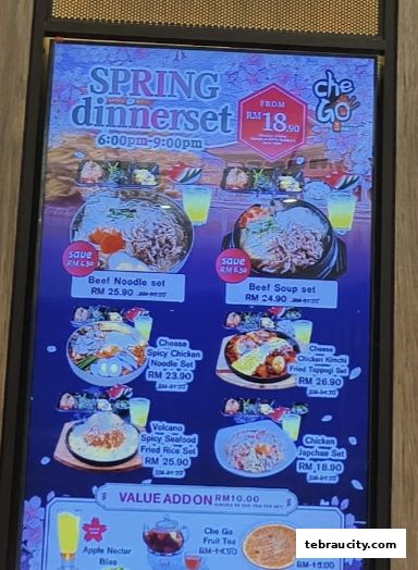 A digital menu board showcasing various Korean dinner sets and value add-ons.