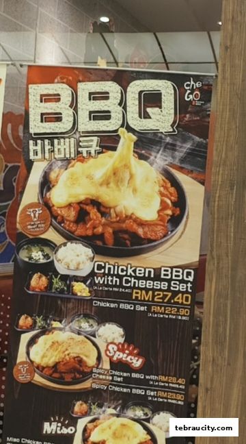 A menu board showcasing Chego Korean BBQ's chicken dishes with cheese.