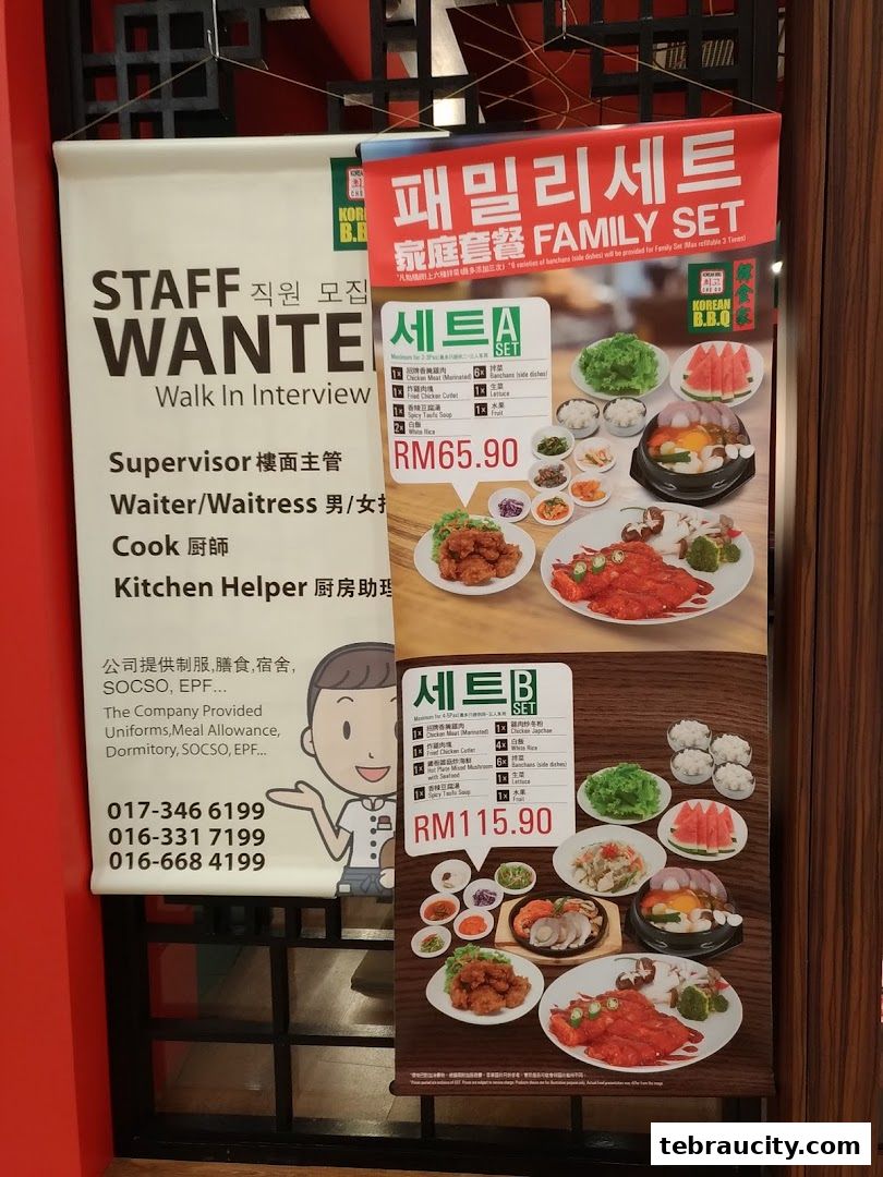 Banners advertising Korean BBQ family sets and staff recruitment for Chego Korean BBQ.