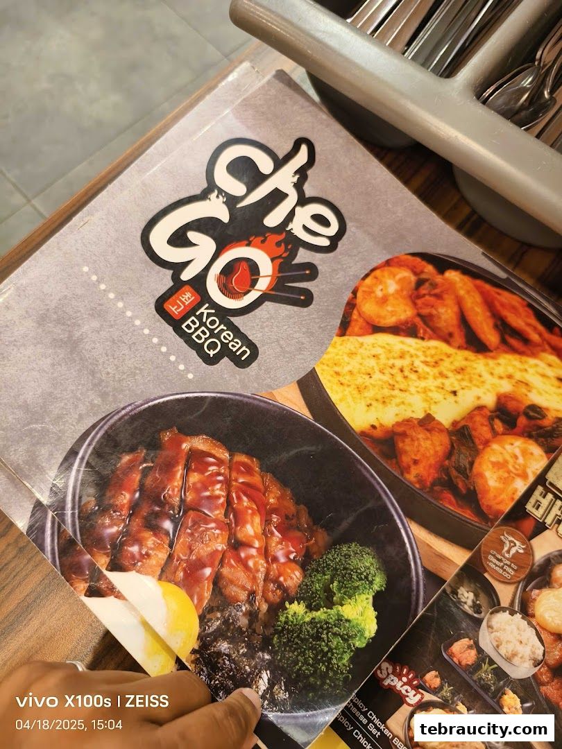 A close-up of a Korean BBQ menu featuring delicious dishes like grilled meat and cheese.