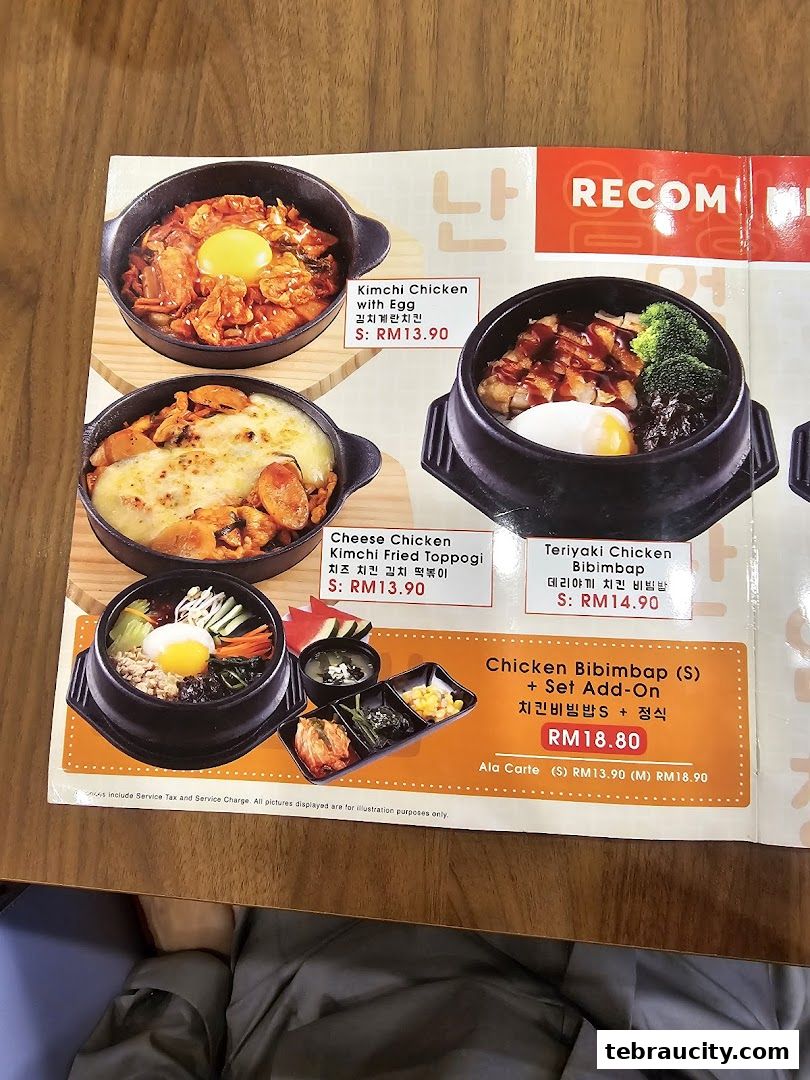 A menu featuring Korean dishes like Kimchi Chicken, Cheese Chicken, and Bibimbap.