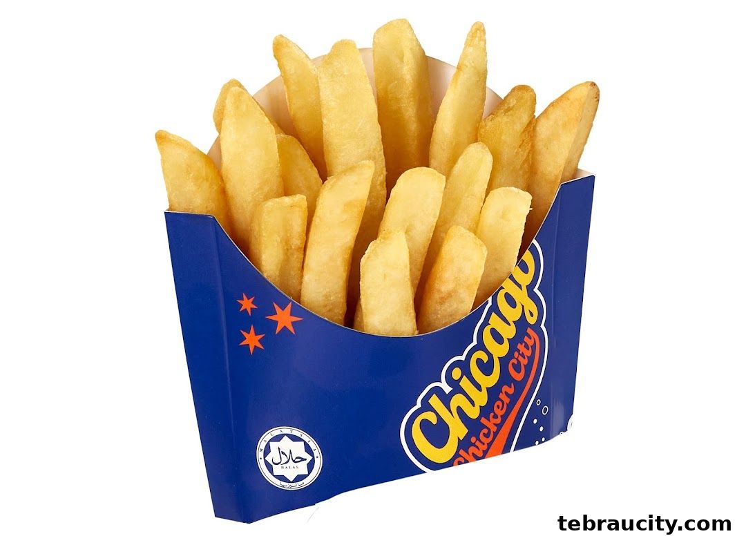 A box of golden French fries from Chicago Chicken City with a Halal certification.
