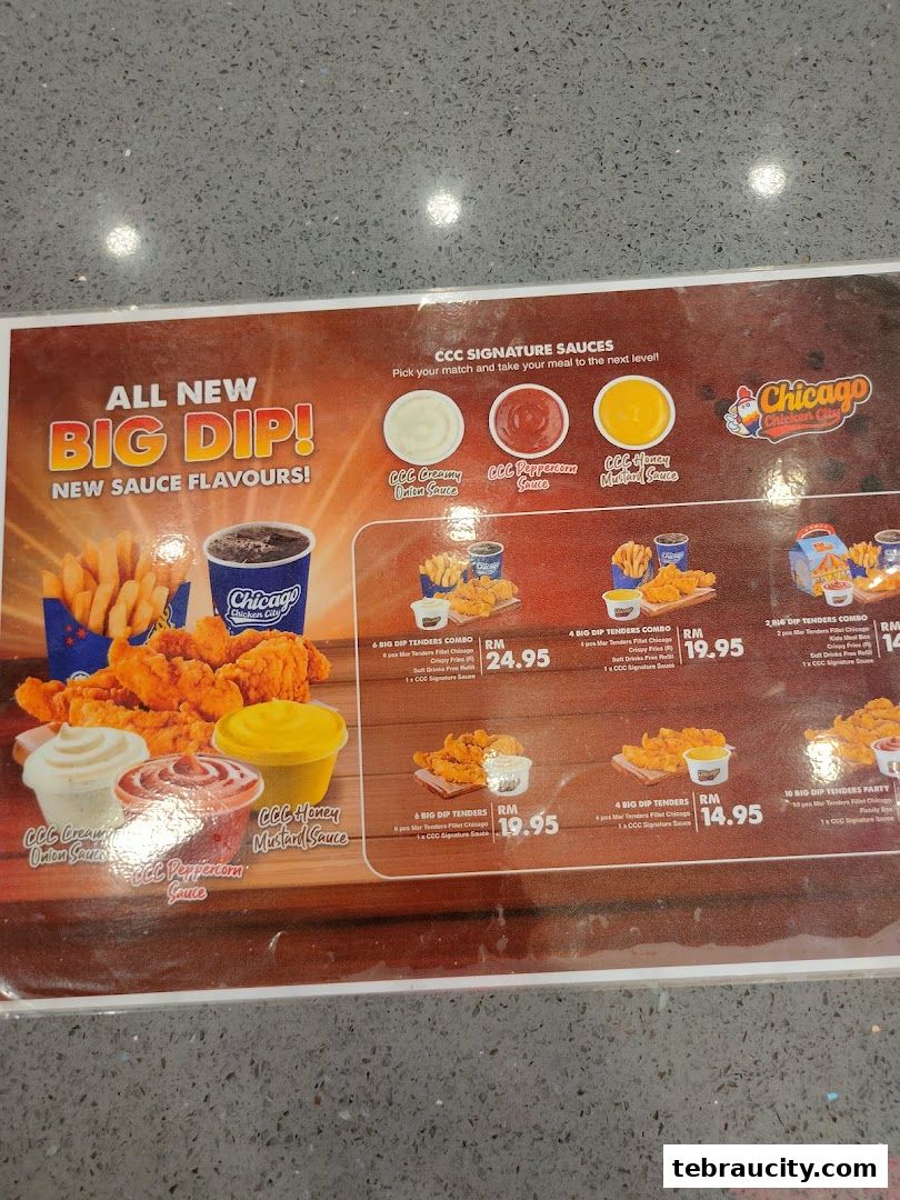 A menu board showcasing Chicago Chicken City's new Big Dip sauce flavors and tender combos.