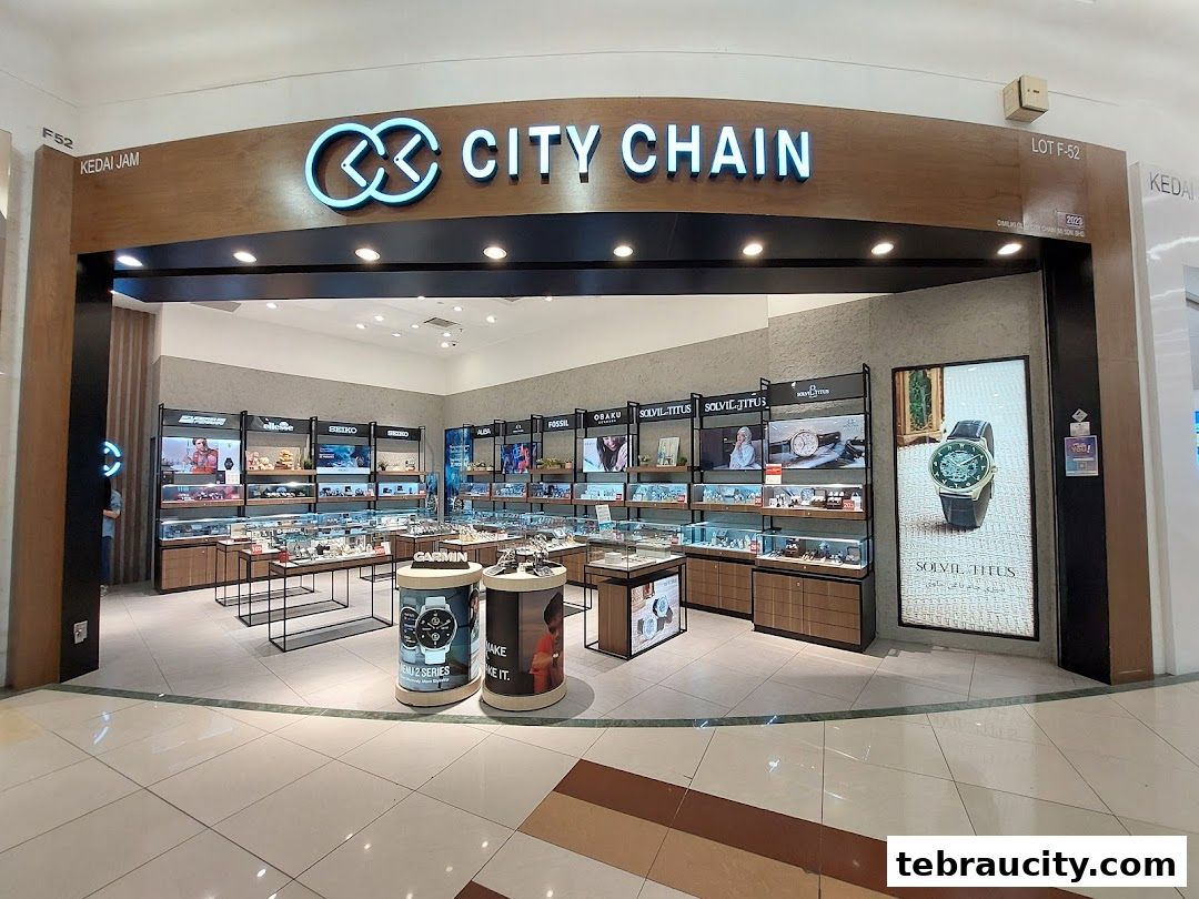 The exterior of a City Chain watch store showcasing various watch brands and displays.