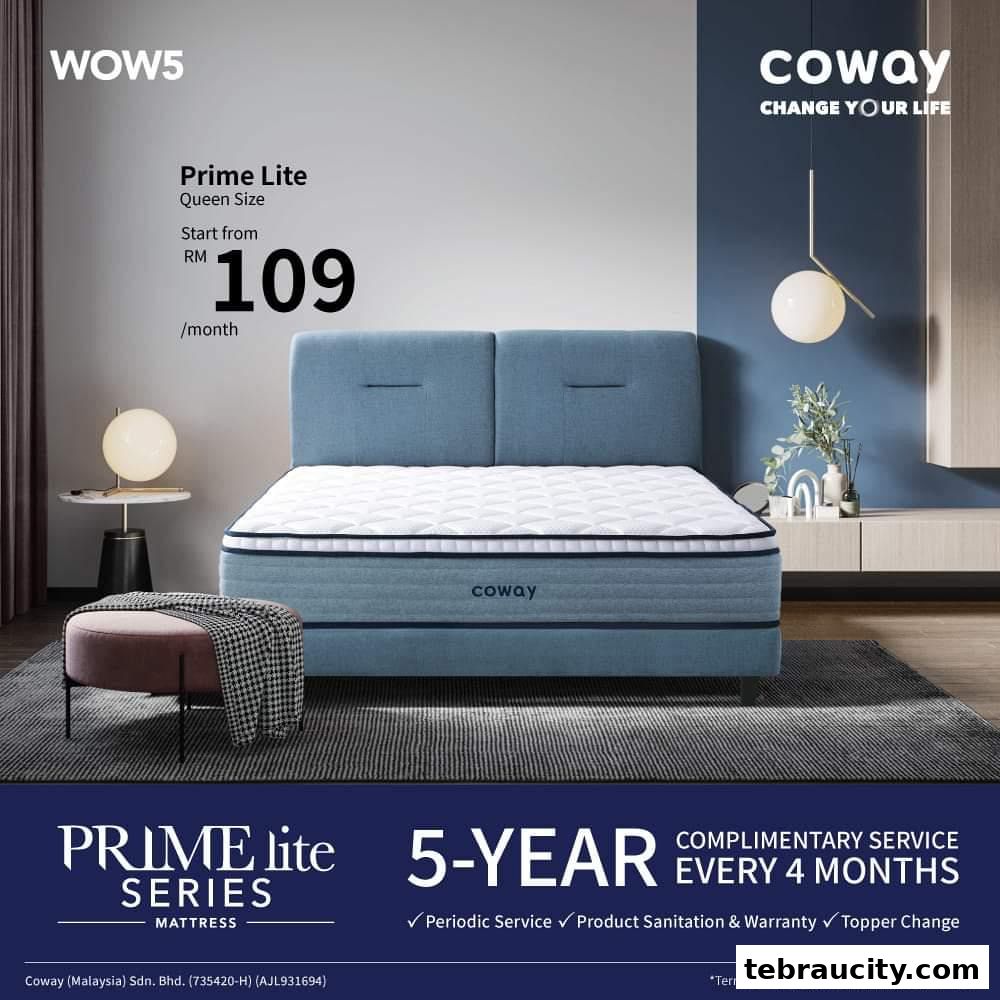 A stylish bedroom scene featuring a Coway Prime Lite Queen Size mattress on a blue bed frame.
