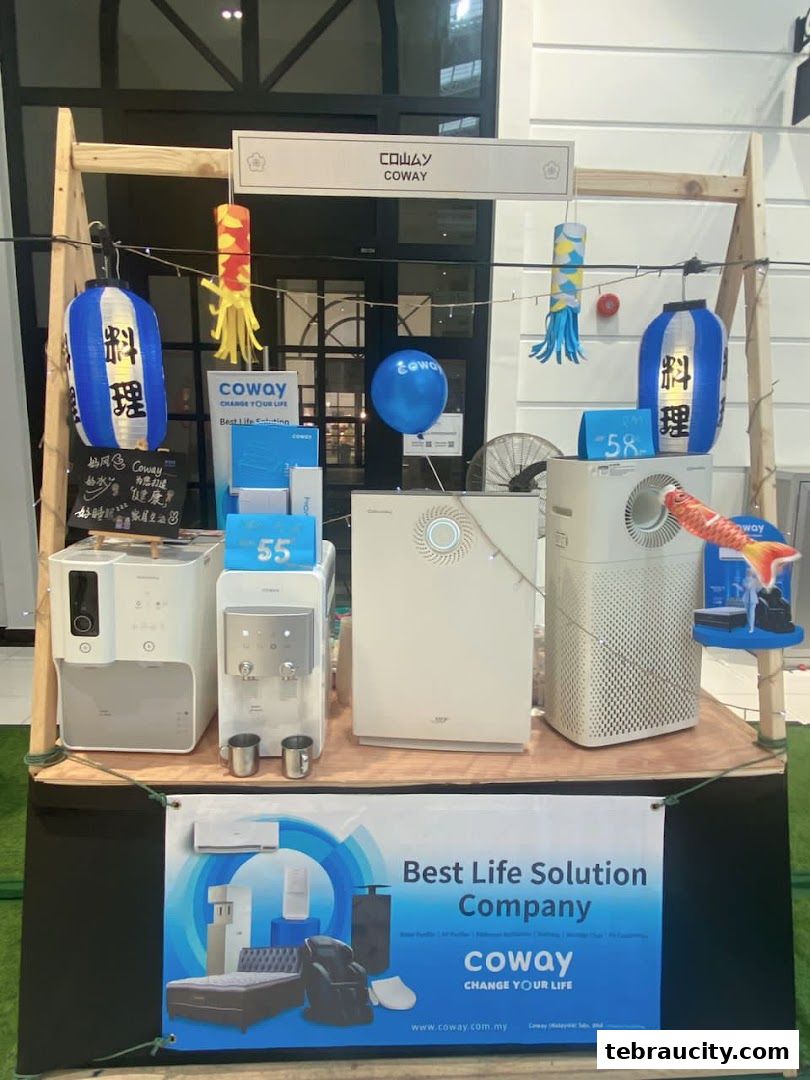 Coway products displayed with Japanese-themed decorations and promotional banners.