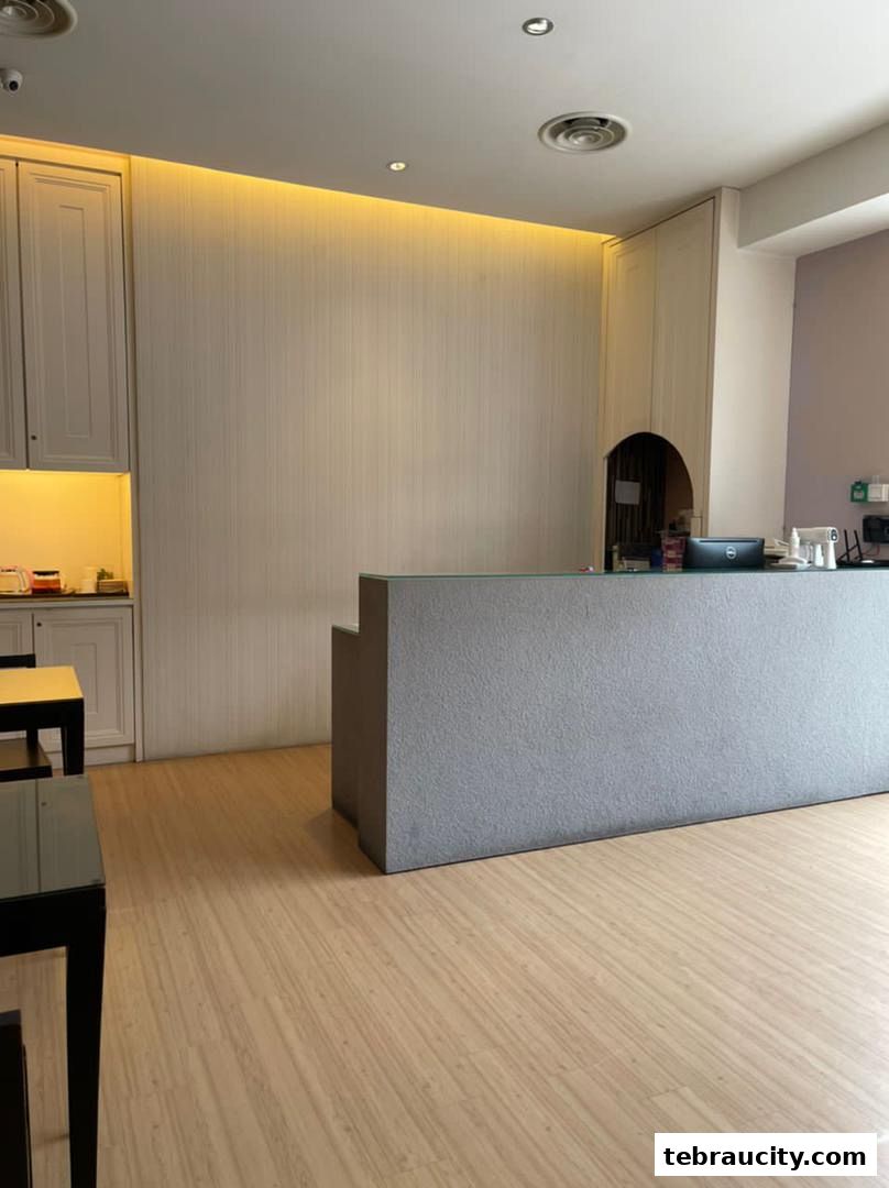 Interior view of a reception area with a counter, cabinets, and seating.
