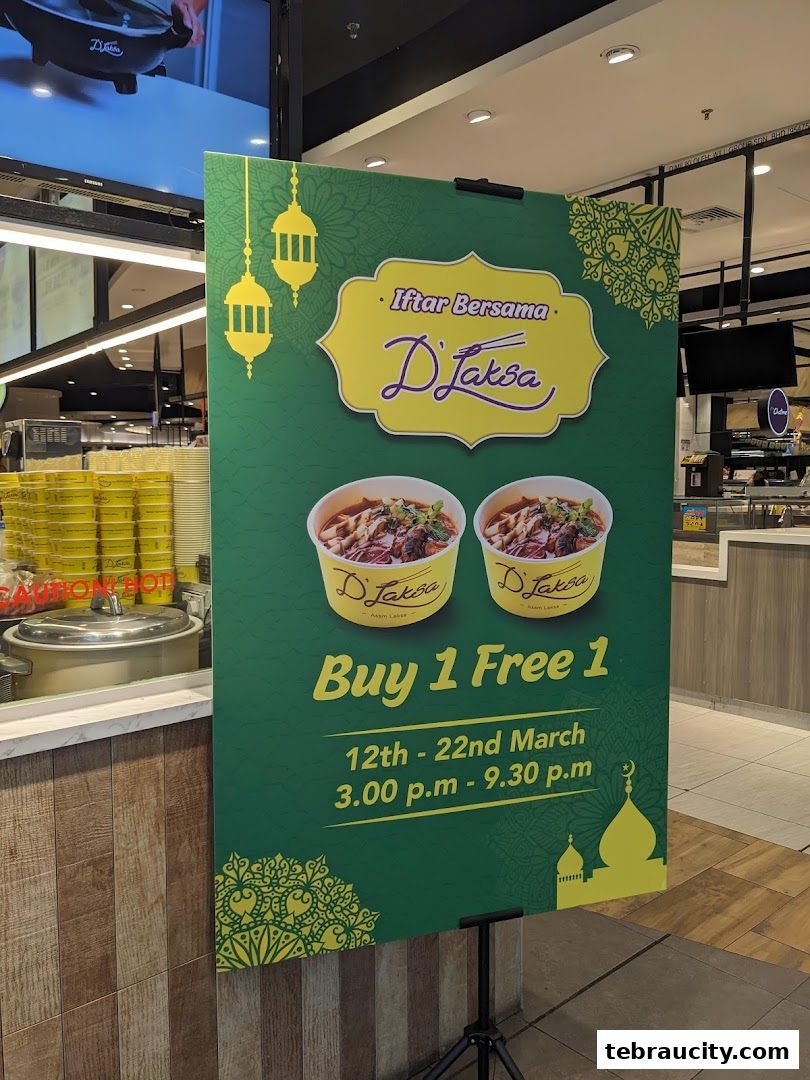 A promotional banner for D'Laksa offering a Buy 1 Free 1 deal during Iftar.