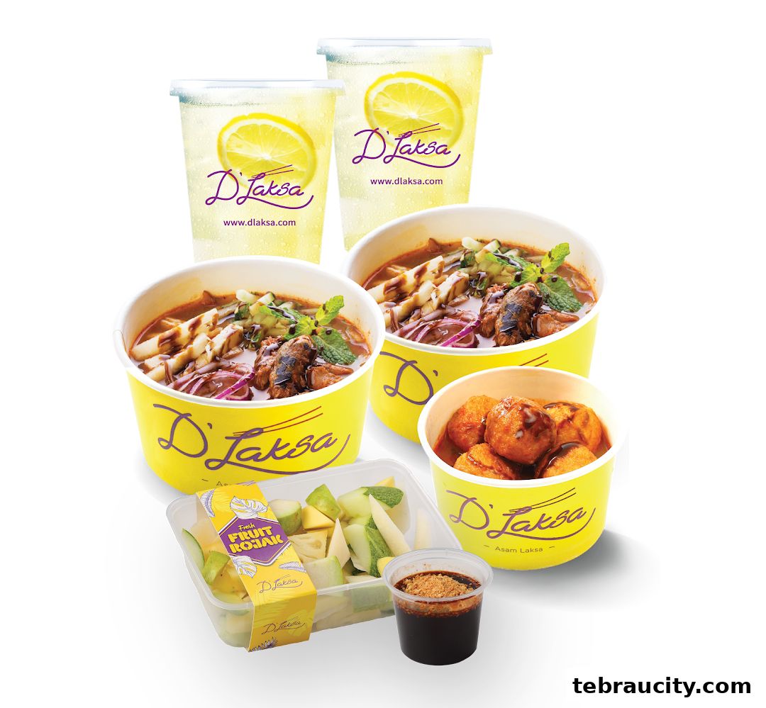 A spread of D Laksa's signature dishes including laksa, fruit rojak, and drinks.