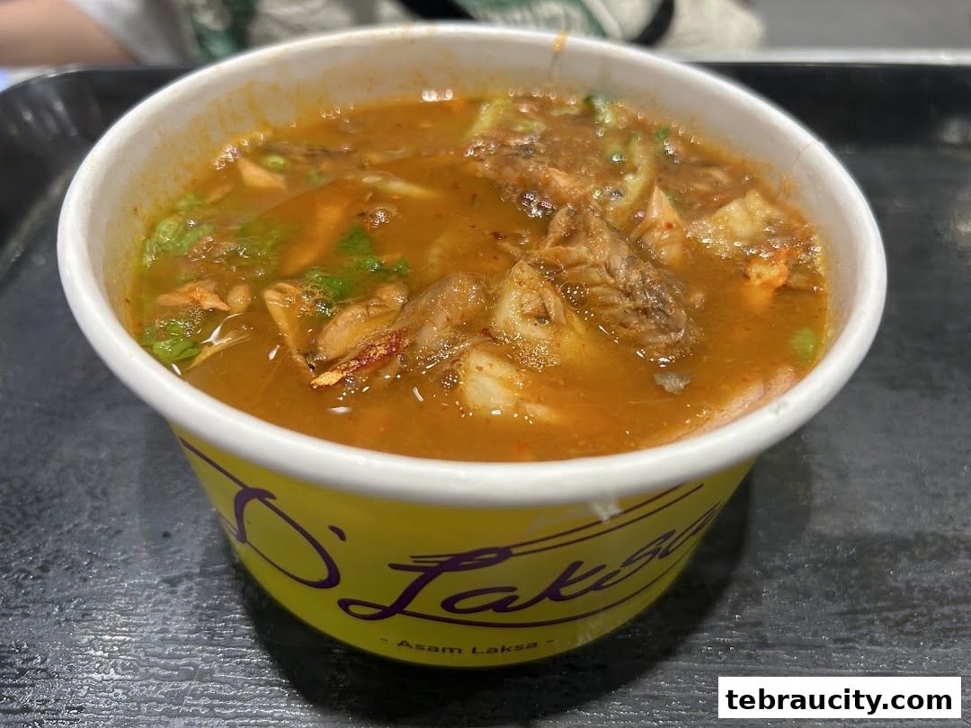 A close-up shot of a bowl of Laksa from D Laksa Aeon Tebrau City.
