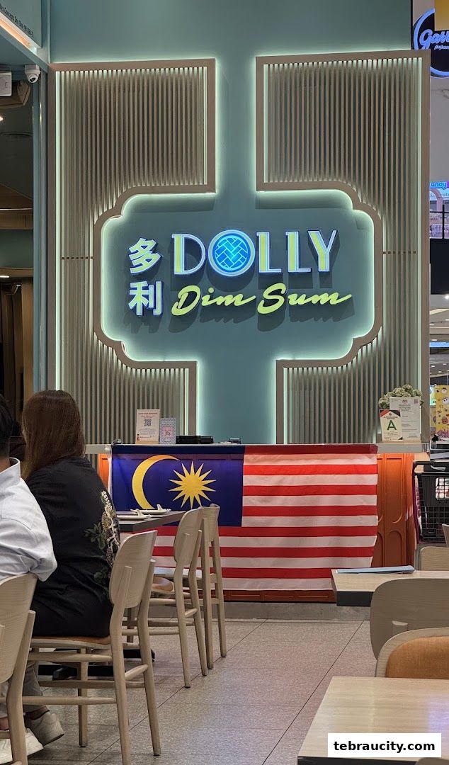 Interior shot of Dolly Dim Sum restaurant with Malaysian flag displayed.