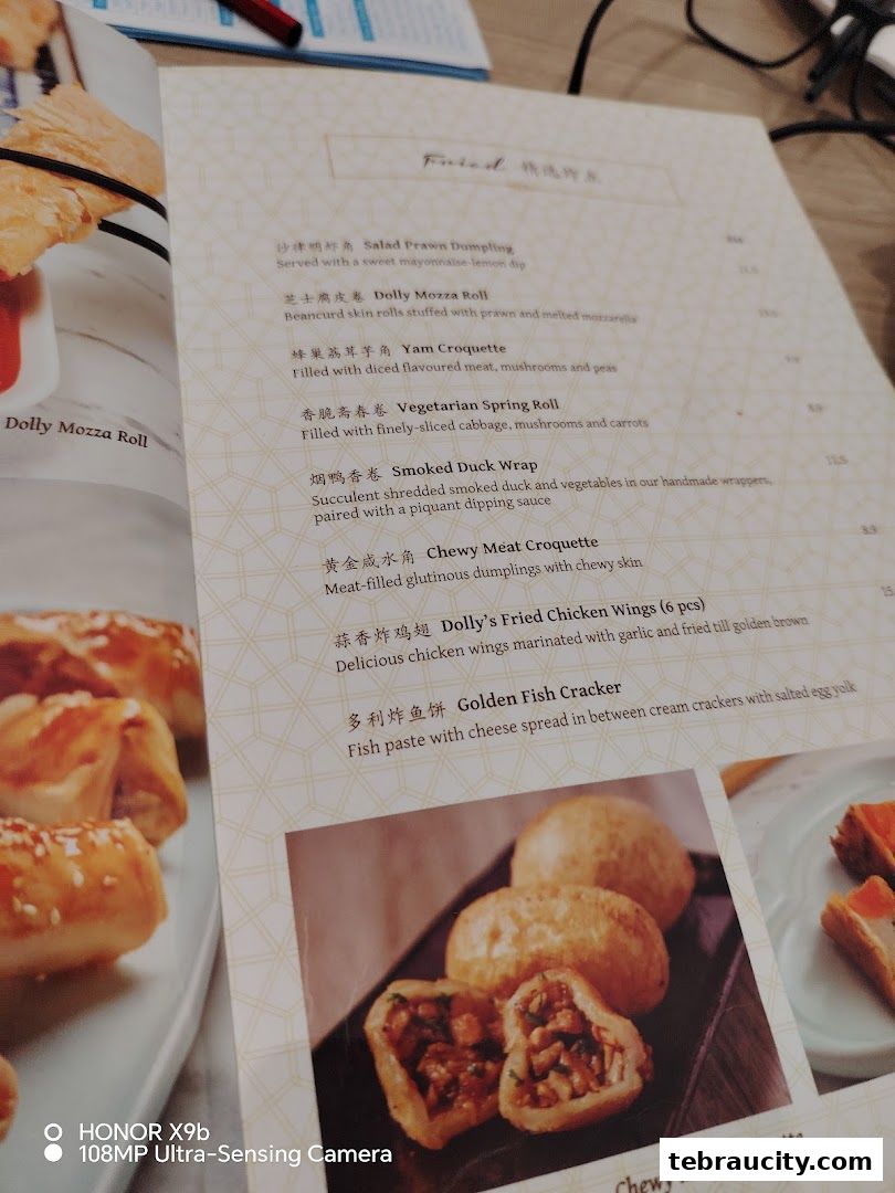 A close-up view of a dim sum menu with various fried items listed.