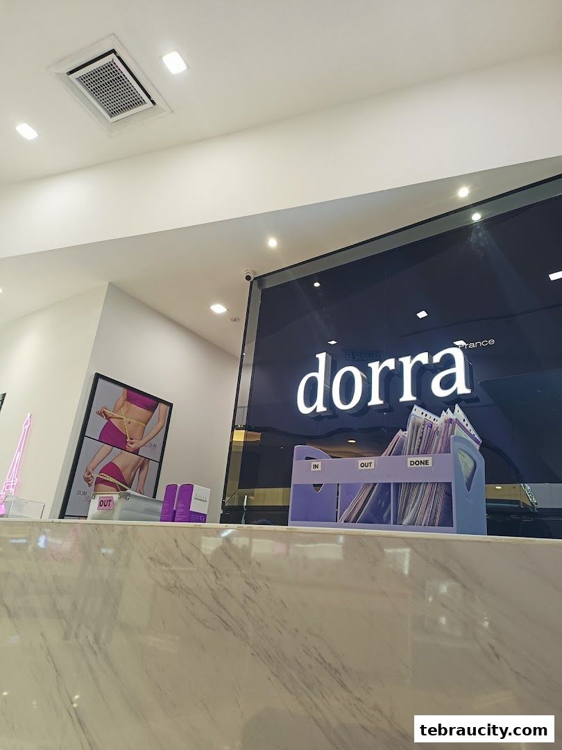 The reception area of Dorra Slimming, featuring the brand logo and promotional visuals.